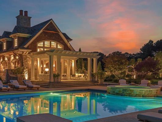 Illuminated pool terrace by Sudbury Design Group